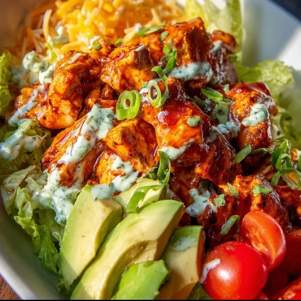 Buffalo Chicken Bowls with spicy chicken, veggies, and creamy dressing
