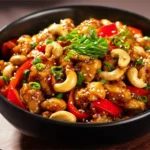 Delicious plate of Cashew Chicken with cashews, vegetables, and chicken pieces.