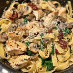 Delicious Tuscan Chicken Pasta with creamy sauce, sun-dried tomatoes, and spinach